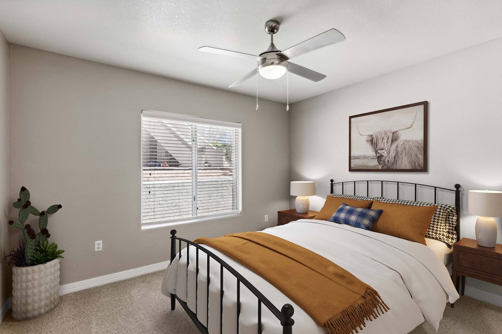 the bedroom of a home with a bed and a ceiling fan at Altezza High Desert, Albuquerque, New Mexico